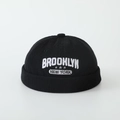 Close-up of black corduroy docker cap with white Brooklyn New York star embroidery - 52cm (2-5 Years) / Brooklyn Letter - Black