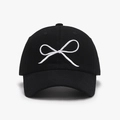 Black baseball cap with white bow embroidery on front and curved brim for women - Black