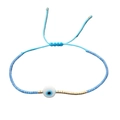 Bracciale con perline occhio blu e cordino regolabile in stile boho intrecciato - Blu Chiaro-Malocchio