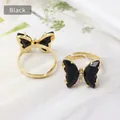 Adjustable gold butterfly rings with black enamel wings and clear zircon accents - Black
