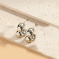 Close-up of silver bean bamboo design stud earrings with polished mirror finish - Bamboo Large Silver