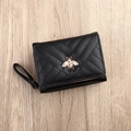 Women's black PU leather short wallet with V-quilting and golden bee detail - Black