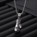 Silver stainless steel necklace with boxing glove pendant on dark jewelry display - Boxing Gloves