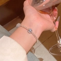 Elegant rose gold chain bracelet featuring dark grey obsidian pendant and white beads - Rose Gold/Metal Links