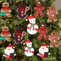 Classic gingerbread man and Santa PVC ornaments hanging on a green Christmas tree - Amazon Hot Sale C (11Pcs)