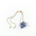 Detail of adjustable gold box chain bracelet with irregular raw blue crystal stone - Blue Sodalite