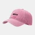 Close-up of pink washed cotton baseball cap featuring black HELLO embroidery details - Adjustable / Pink