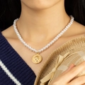 Elegant single strand pearl necklace with a vintage gold coin pendant on a model - Pearl Necklace with Gold Coin