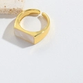 Adjustable golden V-shaped ring with rectangular white stone inlay in a minimalist design - Glossy