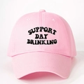 Pink cotton baseball cap with black Support Day Drinking embroidery on a white background - Light Pink