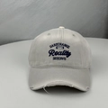 Close-up of embroidered letters on grey distressed cotton baseball cap with ripped brim - One Size (58-60cm) / Gray