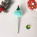 Close-up of a green Christmas pom-pom ballpoint pen with a mini tree and festive decor - Christmas Tree