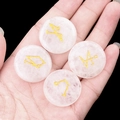 Set of four rose quartz stones with engraved golden archangel symbols held in hand - Set of 4 / White Crystal