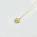 Elegant gold O-chain necklace featuring a 3D irregular heart-shaped pendant on white background - Pitted Heart (Gold)