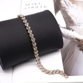 Elegant gold-tone bracelet with sparkling crystals and a wavy link design for women - Rose Gold Bracelet