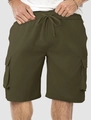 Detail view of olive green cargo shorts featuring elastic drawstring waist and large pockets - Grass Green