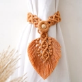 Detail of leaf-shaped handwoven cotton curtain tieback with wooden beads in orange-brown - Style A Woven Pattern / Apricot