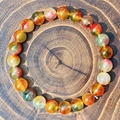 Natural 8mm multi-color gemstone bead bracelet with mixed crystals on wooden tray - Malachite Style Multi-color