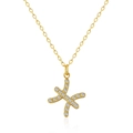 Macro shot of 18K gold plated O-chain necklace with sparkling zircon-studded cross pendant - Pisces