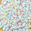 Macro shot of colorful resin clouds stars and moon charms for DIY nail art and jewelry - Star Moon Cloud