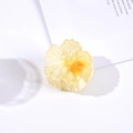 Detailed close-up of a 4.5cm yellow gradient flower hair claw on a minimalist background - Yellow