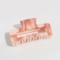 Detail of pink marble and cream resin hair claw clip with smooth rectangular design - Pink Ink Marble