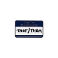 Close-up of enamel pin with They/Them pronouns and blue Hello My Pronouns Are text - They/Them Name Badge
