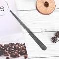 Sleek black stainless steel candle trimmer with an elegant leaf pattern engraving - Black Wick Hook
