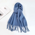 Close-up of thick light blue knit mohair scarf featuring classic long fringe tassels - Sky Blue