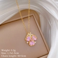 Detail of pink heart-shaped clover pendant in gold titanium steel with cubic zirconia - Pink Clover Style (F544)