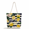 Detail of nautical rope handles and vibrant lemon prints on a striped canvas beach tote bag - Striped Lemon Flower Print (ms0649)