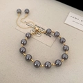 Gunmetal grey freshwater pearl bracelet with gold accents and adjustable slider clasp - Gun Black Pearl Bracelet