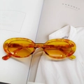 Retro oval sunglasses featuring amber tortoiseshell frames and yellow tinted lenses - Yellow Dots
