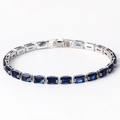 Elegant silver bracelet featuring deep blue rectangular zircon gemstones and secure clasp - Blue Zirconia White Gold