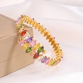 Macro detail of multicolored marquise-cut stones set in a luxury gold titanium bracelet - Multicolor