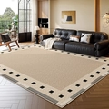 Modern French beige area rug with black geometric patterns in a luxury living room setting - Persian Velvet - Sydney Bay Side