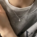 Minimalist silver chain necklace featuring an oval pendant with crystal inlay on a model - Oval White Rhinestone Pendant Style (XL1479)