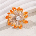 Exquisite orange floral brooch with central faux pearl and sparkling rhinestone accents - Orange Pearl Flower Style (HC0290)
