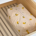 Beige quilted makeup bag with lemon floral print and white zipper closure - Lemon