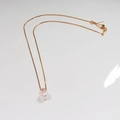 Classic freshwater pearl necklace with gold chain and zircon pendant on white background - Princess Style Pendant / Gold/White