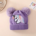 Detail of purple knitted hat for girls featuring unicorn embroidery and dual pom poms - One Size (1-4Y) / Unicorn-Purple