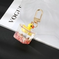 Creative 3D little yellow duck keychain inside a liquid acrylic cube with gold hook - Red Base Duck