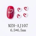 Macro view of 6.5mm red heart nail gems with silver alloy base on red manicure - Multi-Rhinestone Border Heart (AJ107)