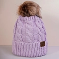 Close-up of lavender cable knit beanie with fluffy faux fur pom-pom and leather logo - One Size / Light Purple