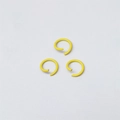 Three yellow metal jump rings for DIY jewelry making displayed on a white background - Yellow