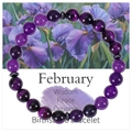 Macro shot of 8mm purple amethyst birthstone bracelet with February wisdom greeting card - February