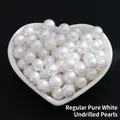 No-hole imitation pearls in pure white finish displayed on a heart-shaped tray - Standard No Hole / 2mm / Pure White