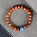 8mm Thuja wood beaded bracelet featuring a turquoise accent bead in ethnic zen style - Single Wrap Turquoise Accent Style