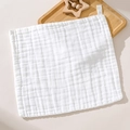 White 6-layer organic cotton gauze baby washcloth with soft wrinkled texture on wooden tray - White