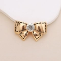 Detail of a golden bow charm with a crystal center and black dotted edges for DIY crafts - D248 Small Bow (Gold)